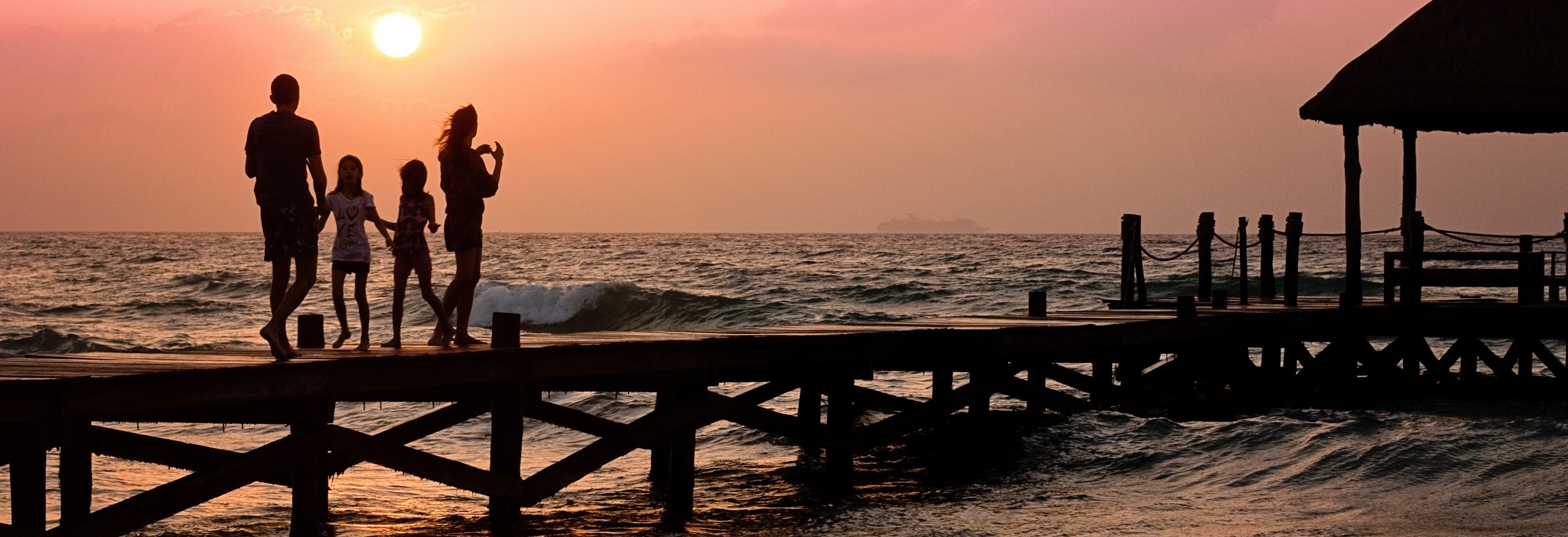 family on pier